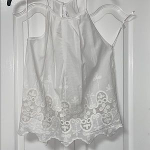 White sleeveless top